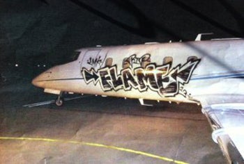 Vandals Tag Learjet with Graffiti