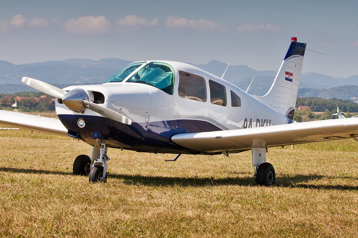 Piper Archer parked at an airfield
