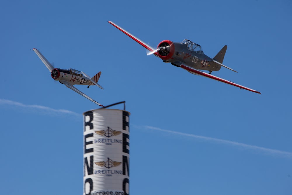 A pair of T-6 racers round a pylon at the National Championship Air Races in Reno, Nevada. [Shutterstock]
