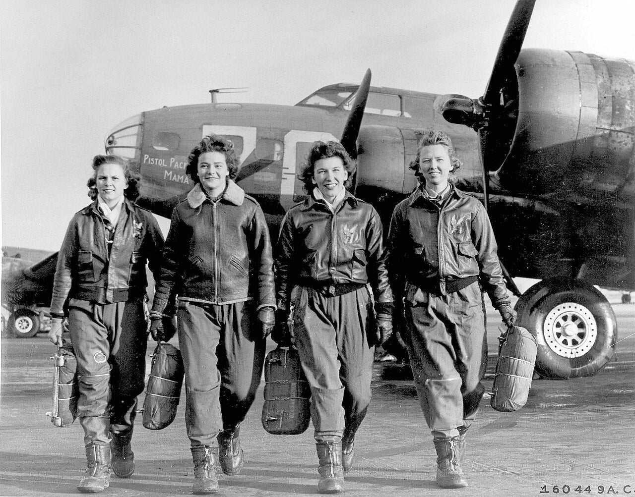 Women Airforce Service Pilots (WASPs) Frances Green, Margaret (Peg) Kirchner, Ann Waldner and Blanche Osborn (left to right) leaving their B-17 Flying Fortresses, Pistol Packin' Mama, at the four engine school at Lockbourne AAF, Ohio. [Photo: U.S. Air Force]