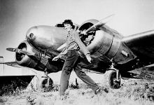 Amelia Earhart walking in front of her Lockheed Electra 10-E [Credit: FLYING Archive]