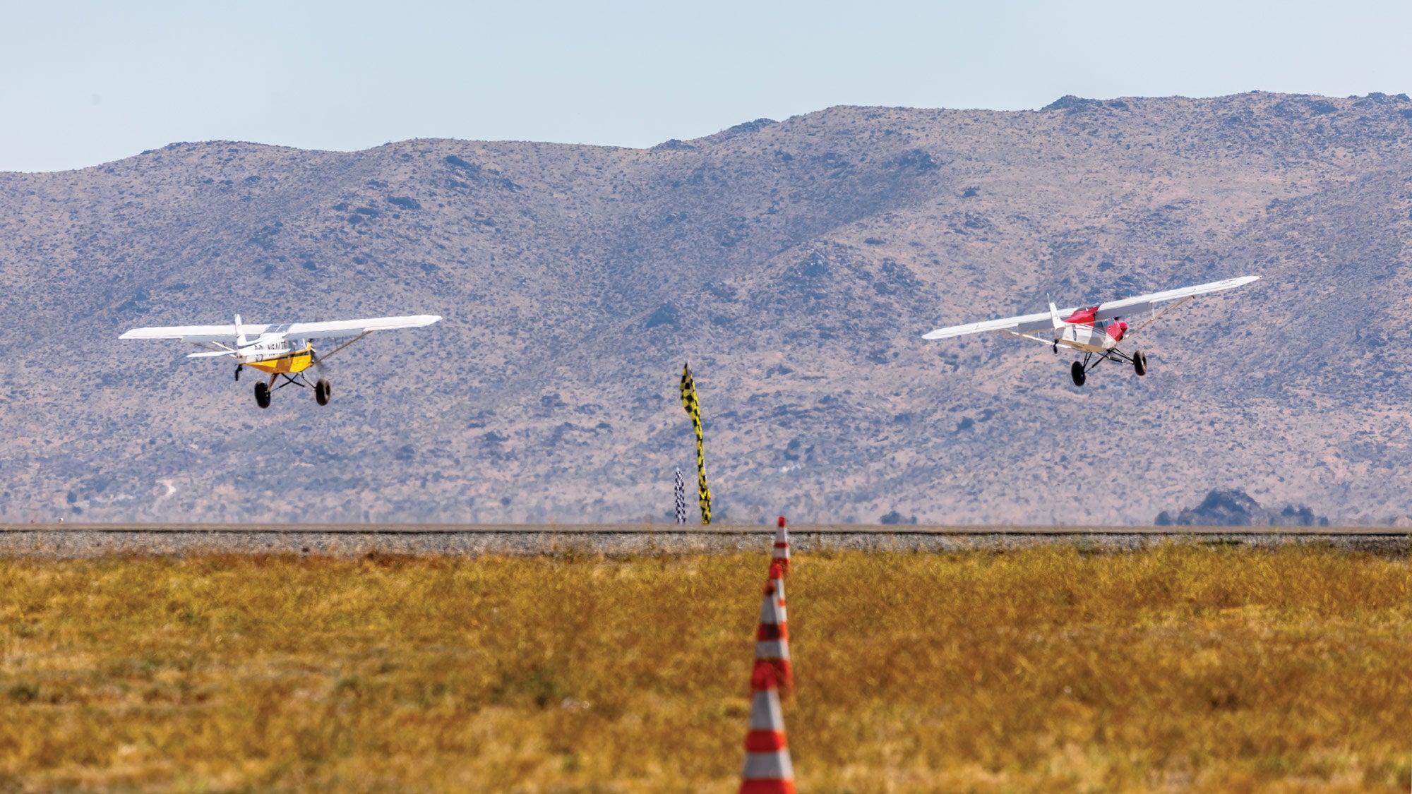 two planes flying side-by-side
