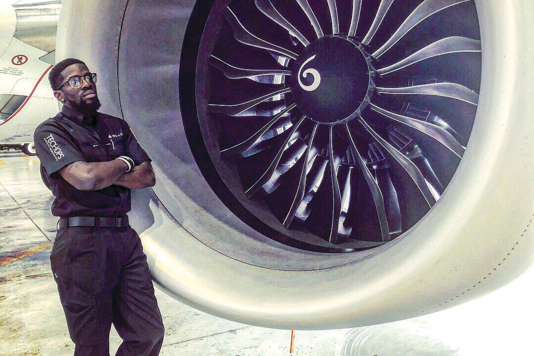 Melvin Williams next to a jet engine