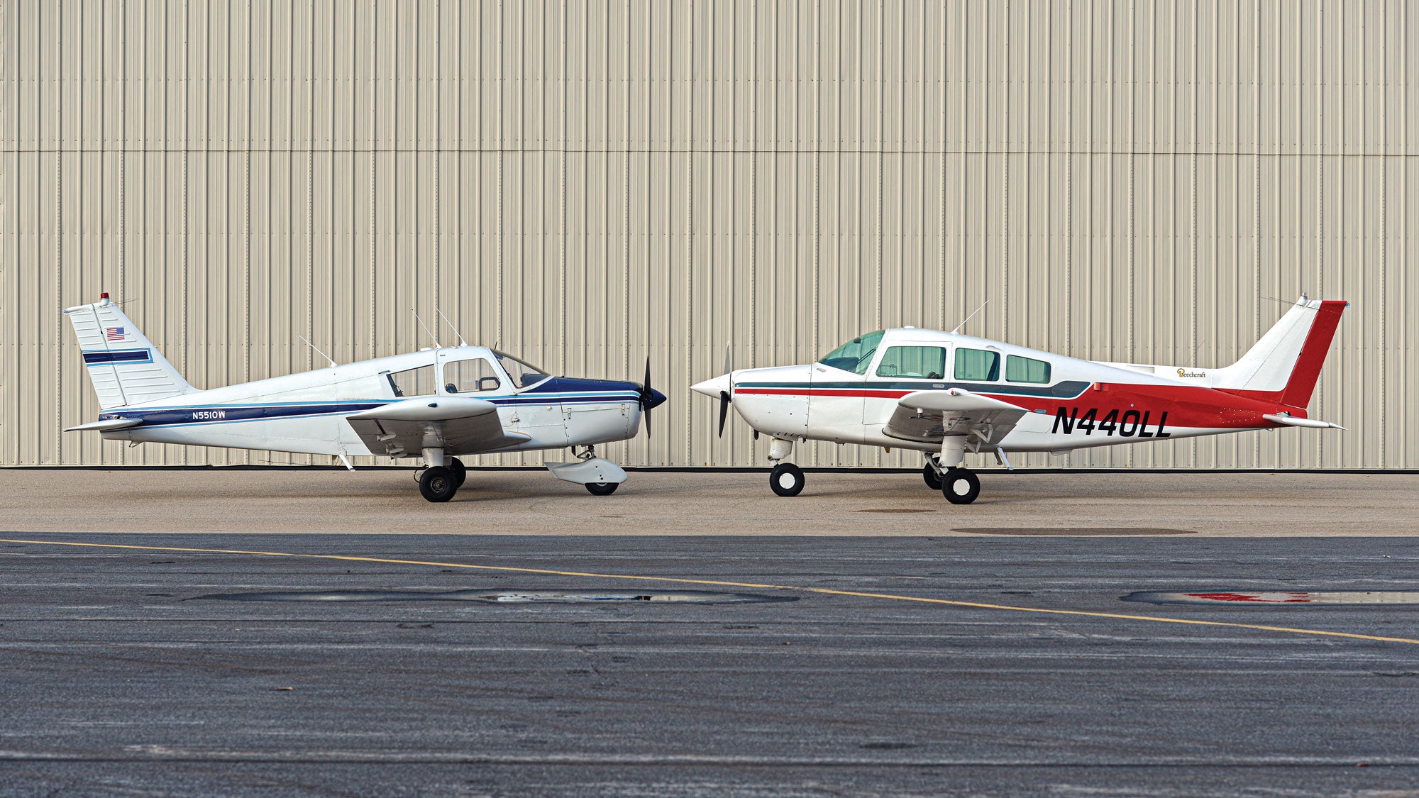 Single engine prop aircraft facing each other.