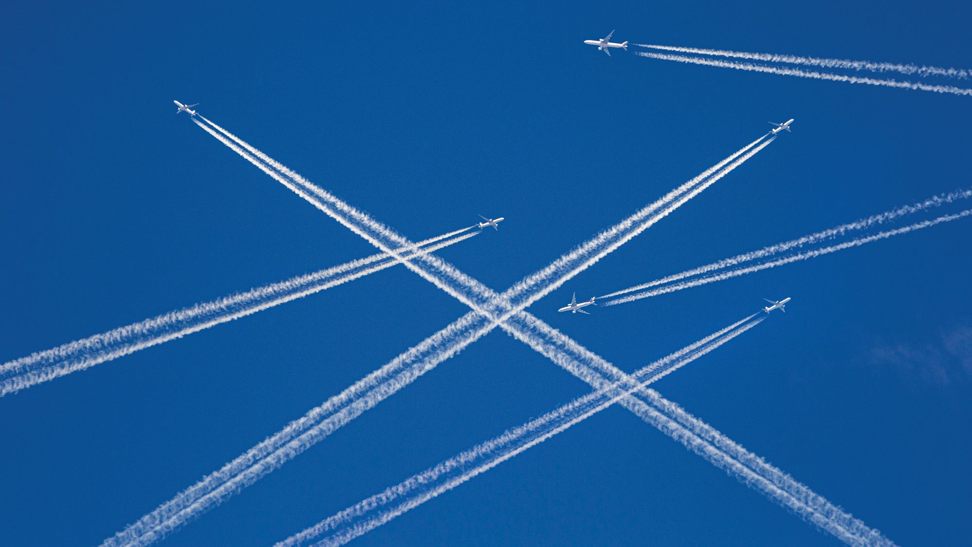 passenger jets flying through the sky