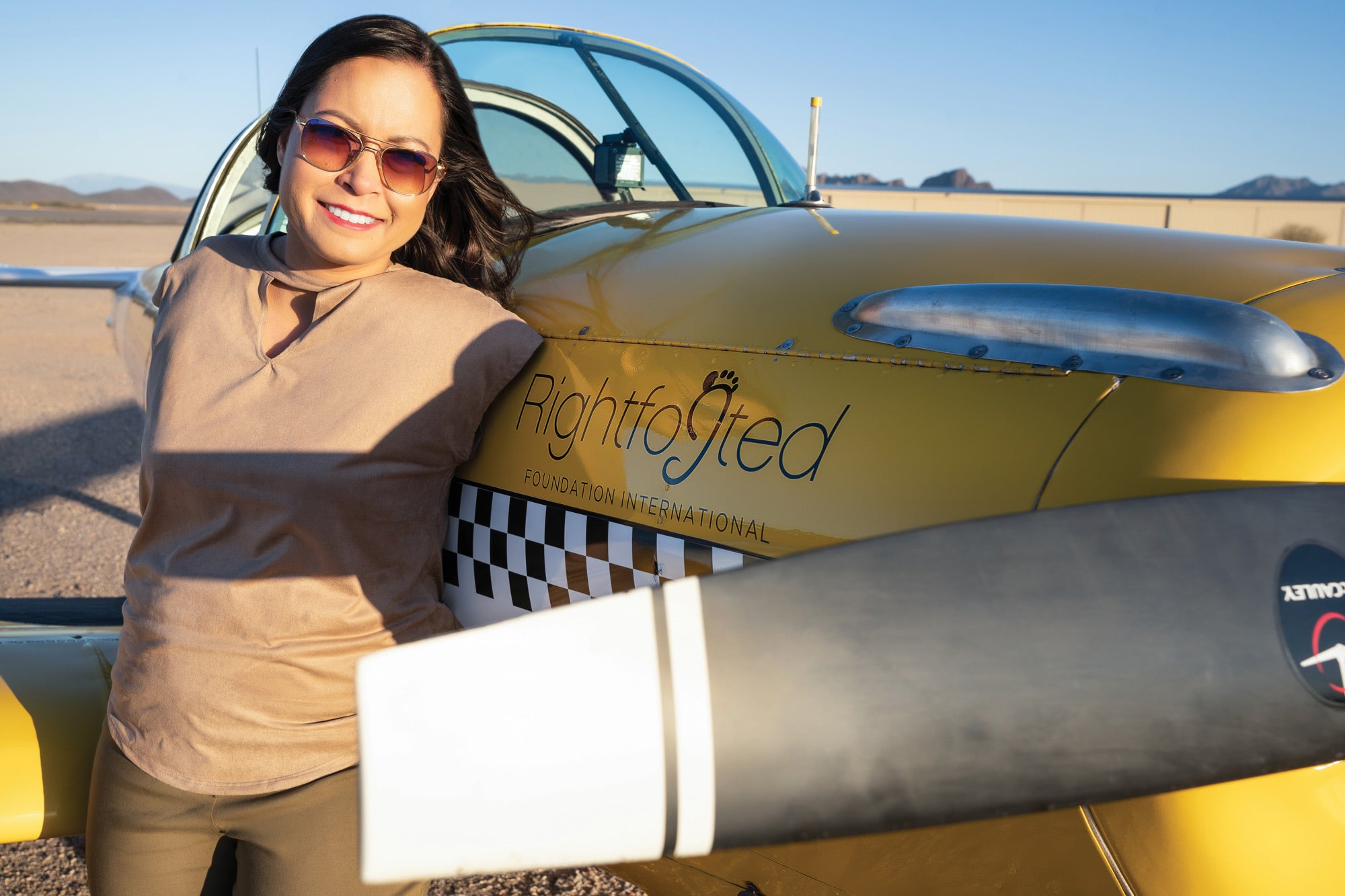 Pilot Jessica Cox next to her Ercoupe.