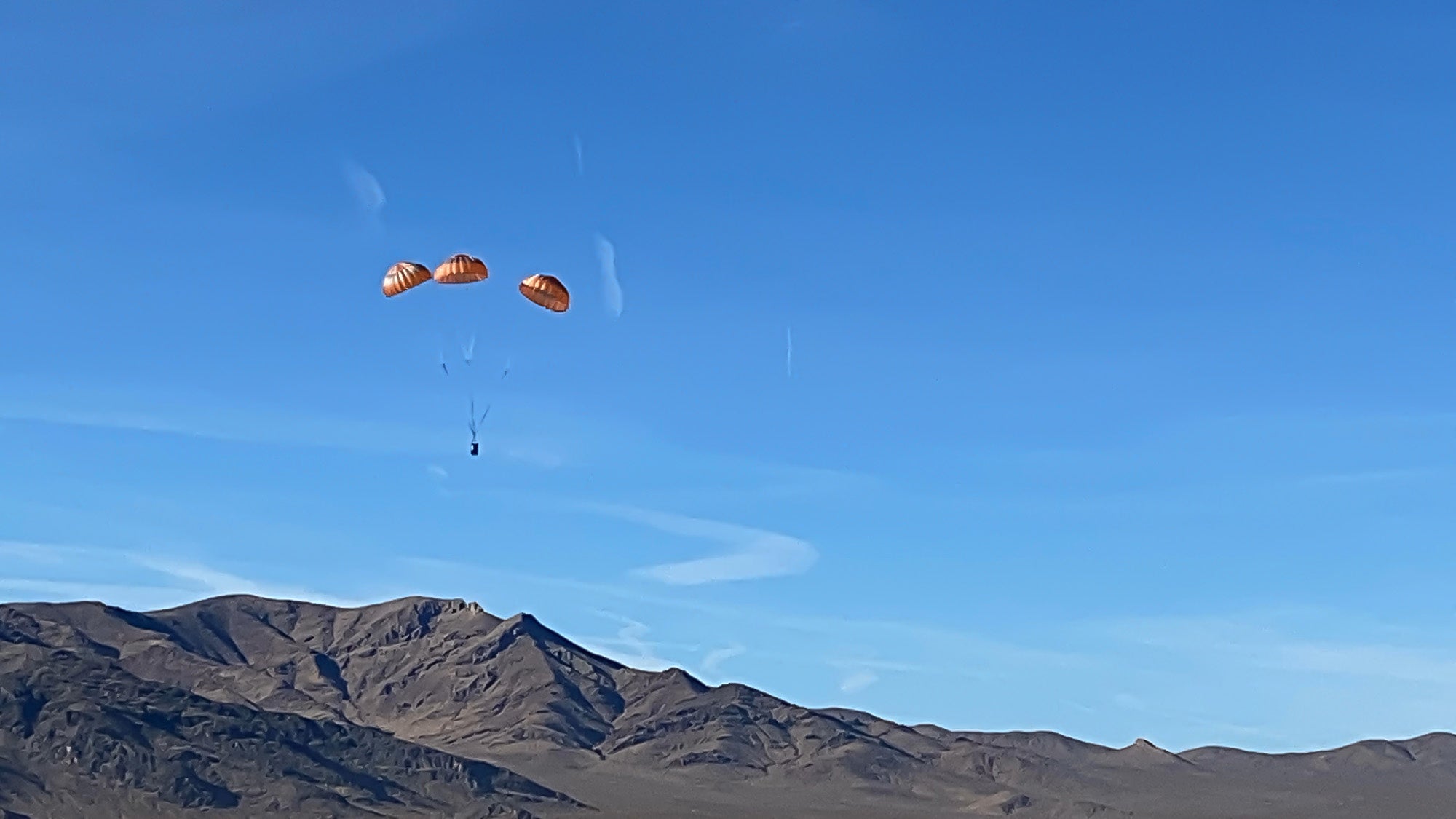 ARS testing equipment descends via parachute