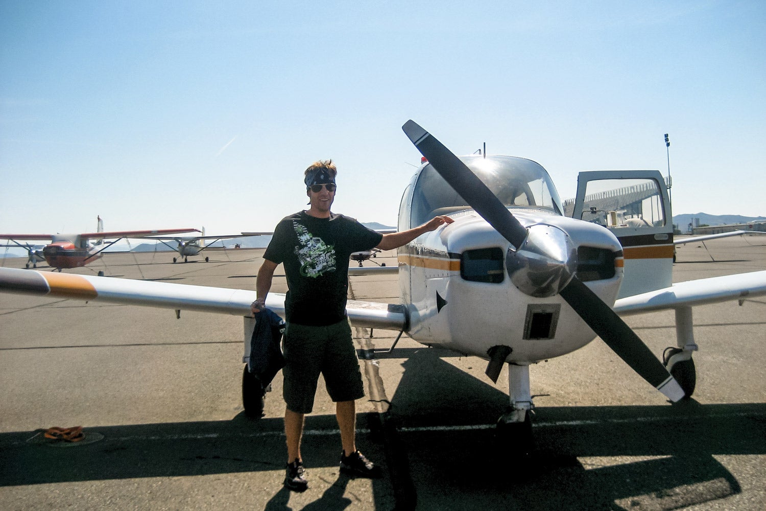 man standing next to an airplane