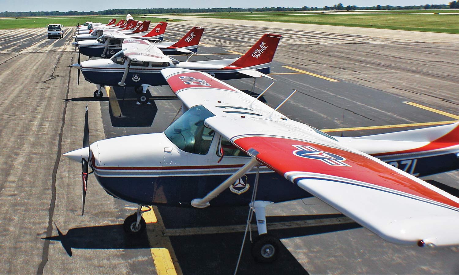 Civil Air Patrol aircraft lined up on the runway