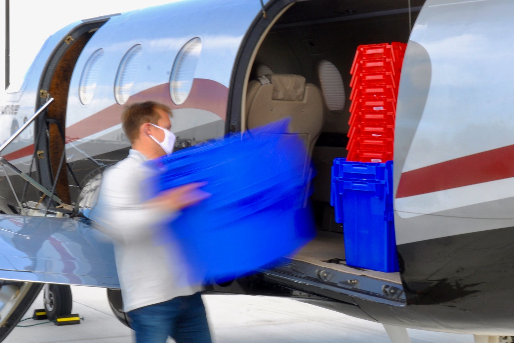 Loading cargo into the back of an airplane.