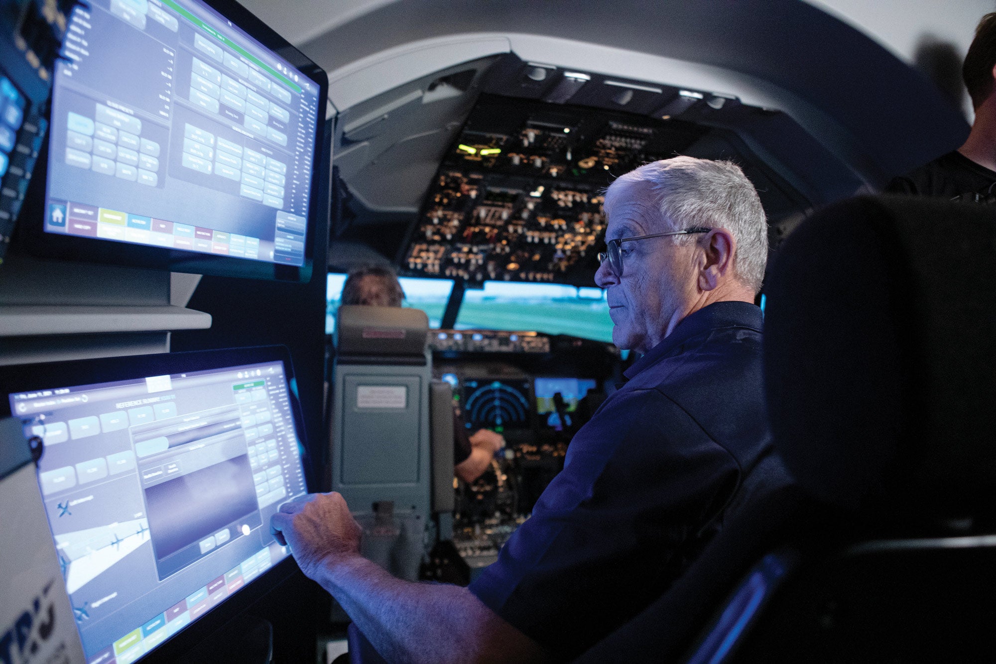 FlightSafety instructor at a simulator station during training