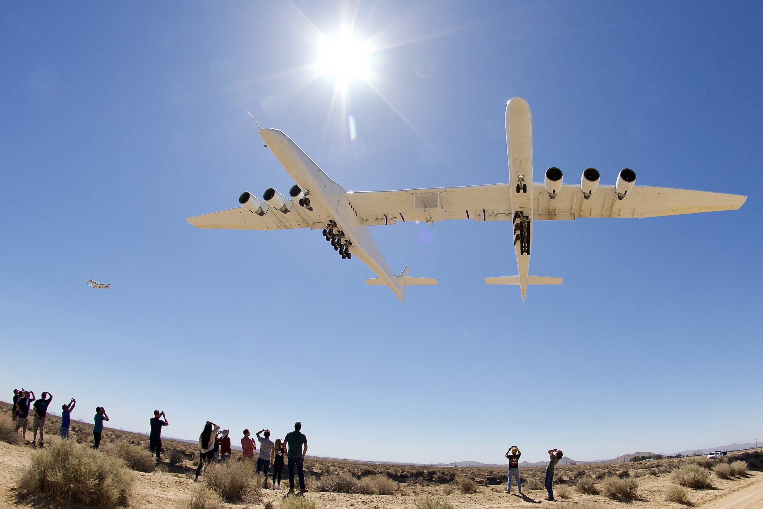 Stratolaunch Roc Flies Over a Group of Photographers