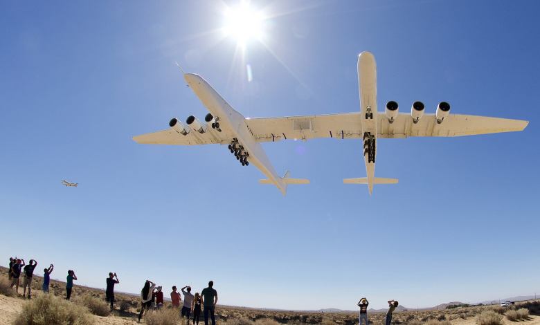 Stratolaunch Roc Flies Over a Group of Photographers