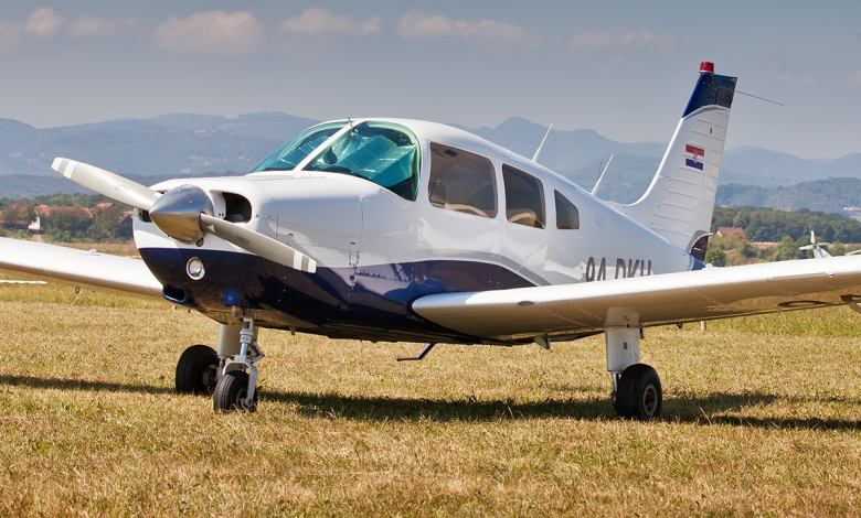 Piper Archer parked at an airfield