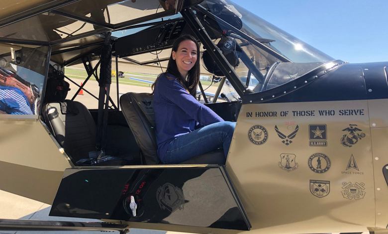 A young woman pictured in the cockpit of an aircraft