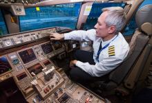 Airline pilot in the cockpit [Credit: Shutterstock]