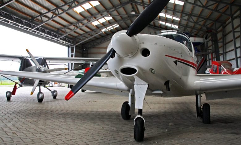 An airplane in a hangar.