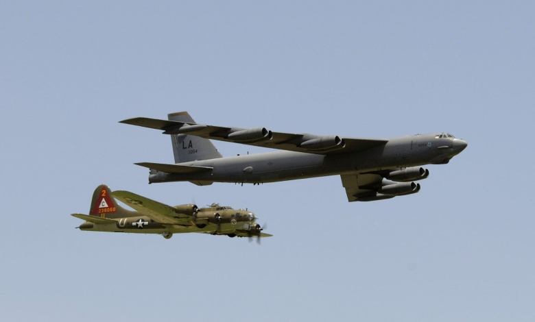 A B-17G Flying Fortress and a B-52H Stratofortress fly in a heritage flight formation.