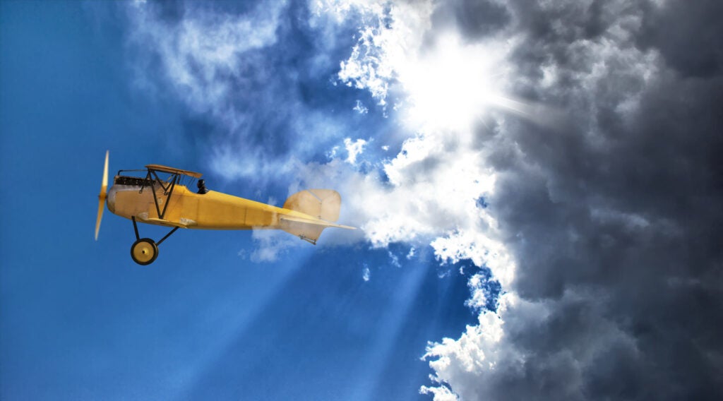 Plane flying in the sky for solutions to complex medical questions that can help pilots pass their FAA exam.