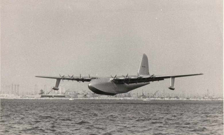 An historic image of the aircraft that would become known as the Spruce Goose, as it starts to lift off the water for its one and only flight.
