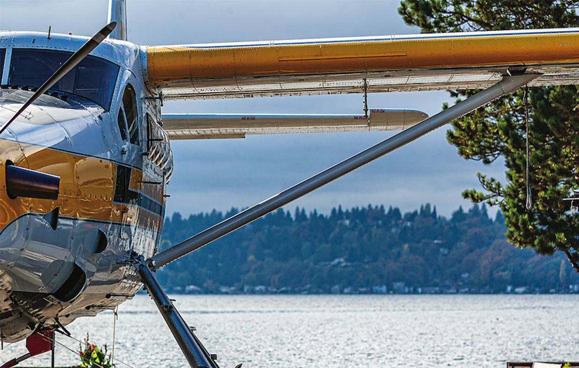 A DHC-3 Otter floats on a lake