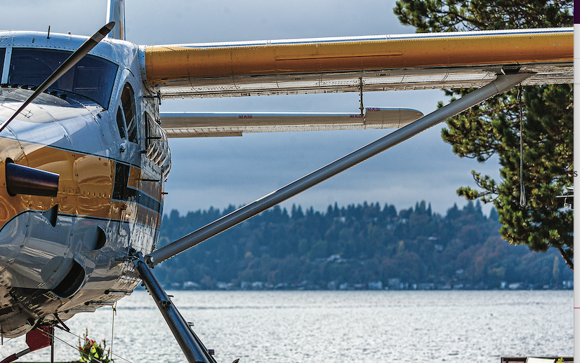 A DHC-3 Otter floats on a lake