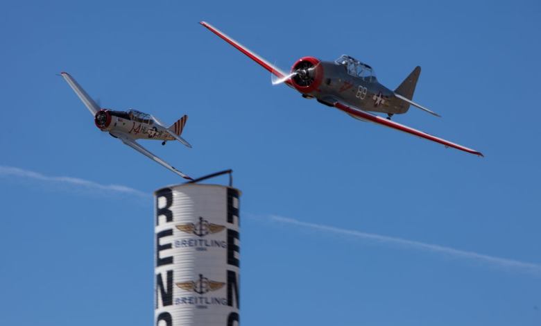 A pair of T-6 racers round a pylon at the National Championship Air Races in Reno, Nevada. [Shutterstock]