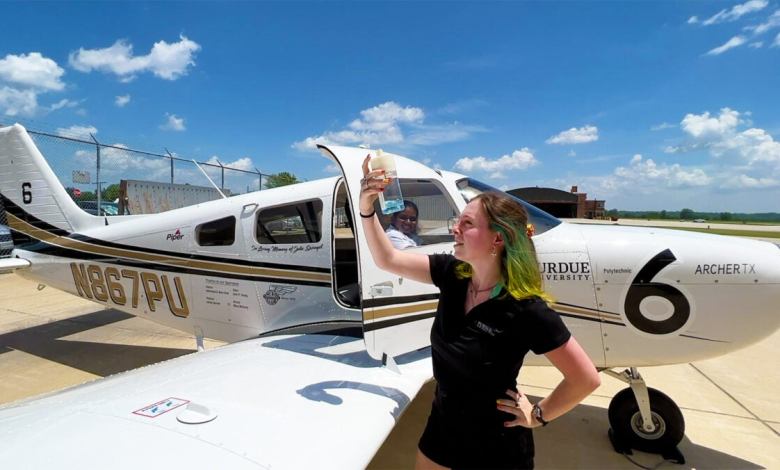 Alex Small, a senior at Purdue University, performs a preflight fuel check for the aircraft her team used for the 2022 Air Race Classic. [Credit: John O’Malley/Purdue University]
