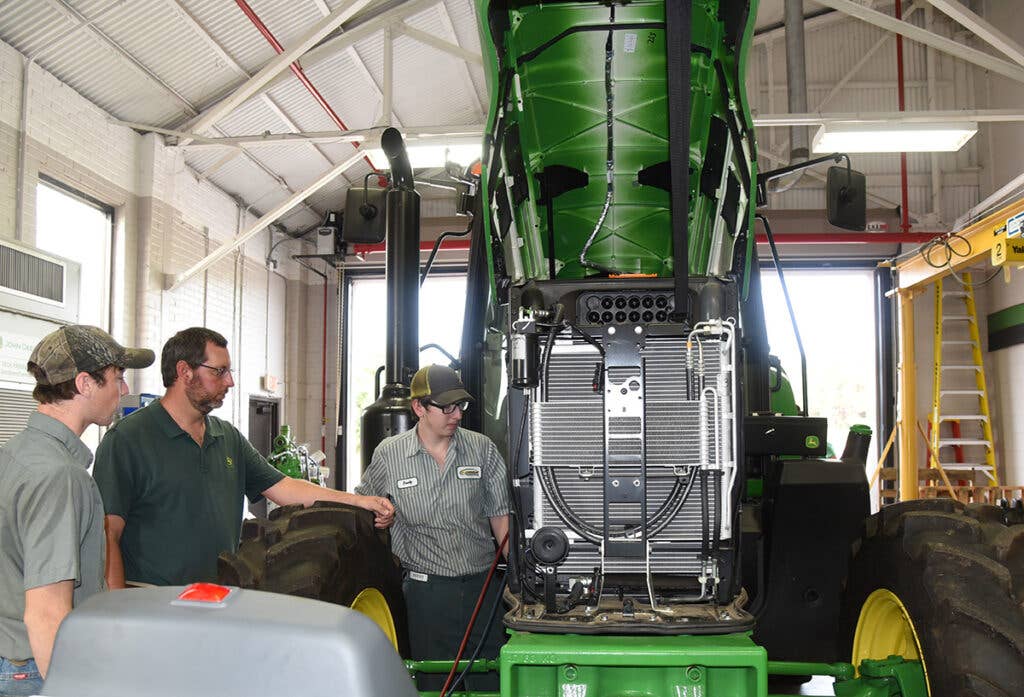 South Georgia Technical College is the John Deere Agriculture Technology Training facility for the Southeastern United States.  Instructor Matthew Burks is shown with students and one of the John Deere tractors they utilize for hands-on training. 75 years of success is definitely worth celebrating!