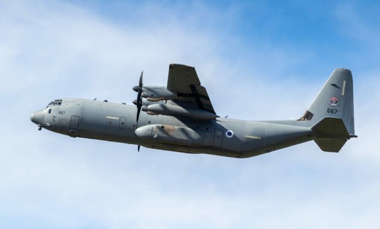 A Lockheed C-130 Hercules military transport airplane in flight.