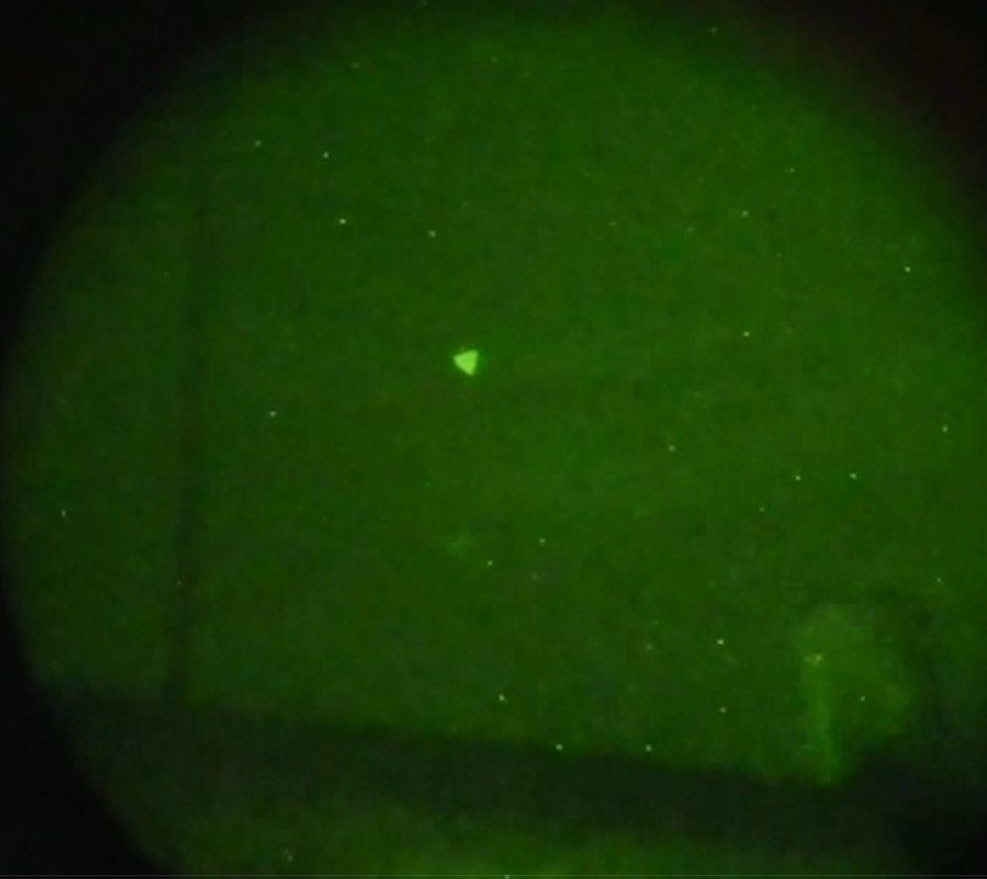 An unmanned aerial system is observed during Naval exercises off the U.S. East Coast in early 2022. The object in this image was first classified as an unidentified anomalous phenomena before being reclassified as a UAS based on additional information and data from other UAP sightings. [Credit: Department of Defense]