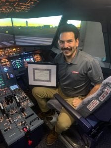 Frontier Airlines Cadet and Airline Career Pilot Program graduate Travis Sowers is recognized as the 20,000th ATP CTP student.