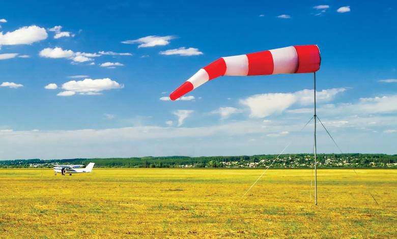 A red and white windsock. [Adobe Stock]