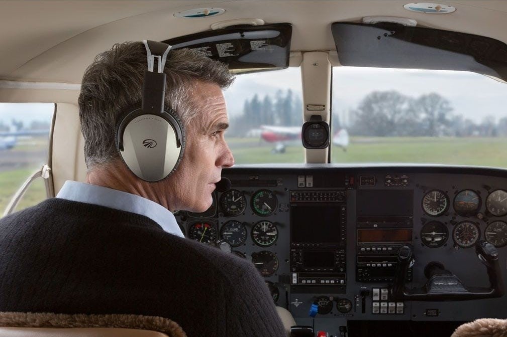 Man wearing Zulu 3 headset in cockpit