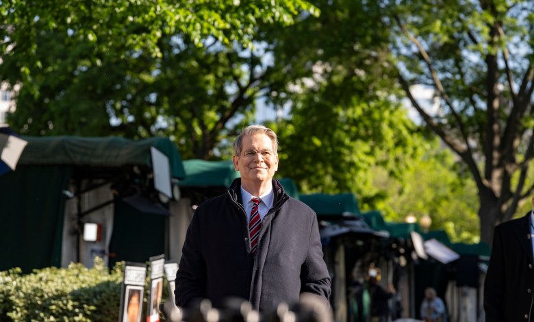 Treasury Secretary Scott Bessent walking to a interview at the White House