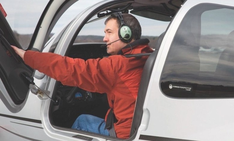 Pilot wearing David Clark headset.