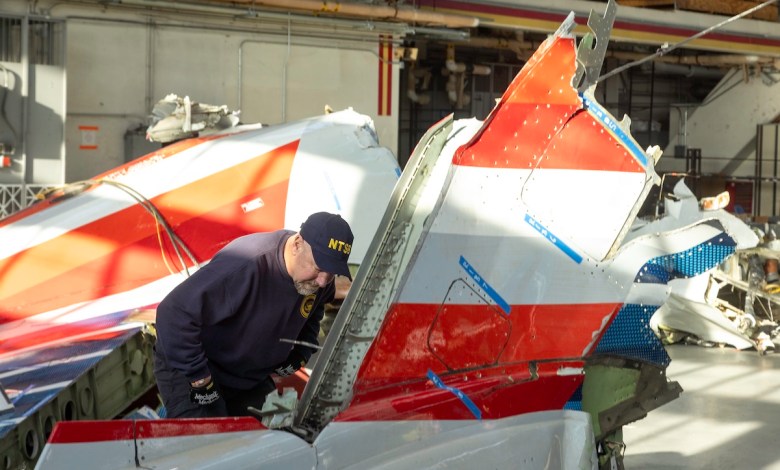 NTSB investigators inspect wreckage of CRJ-700