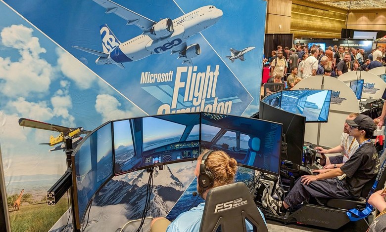 FlightSimExpo attendees at an exhibit in 2024.