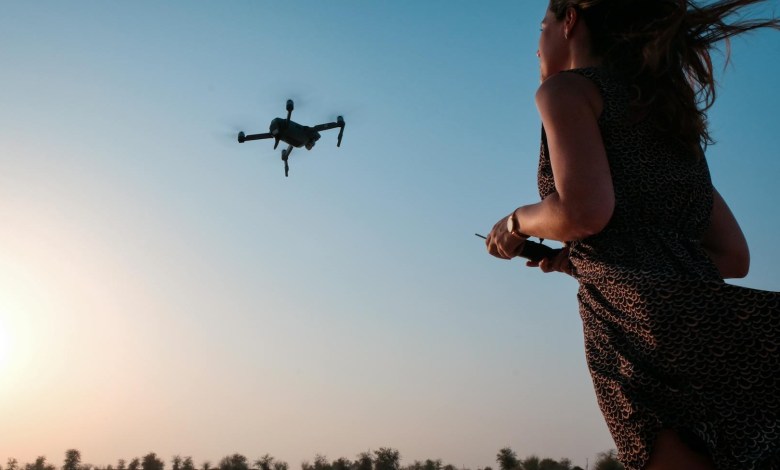 Woman flying a drone