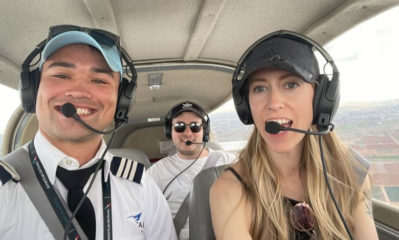 Three aviators wearing headsets.