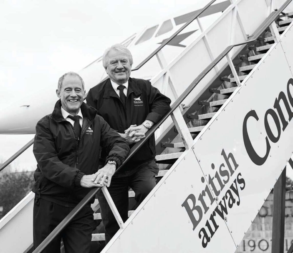 Captains John Tye (left) and Mike Bannister on Concorde’s stairs. [Credit: Jeff Berlin]