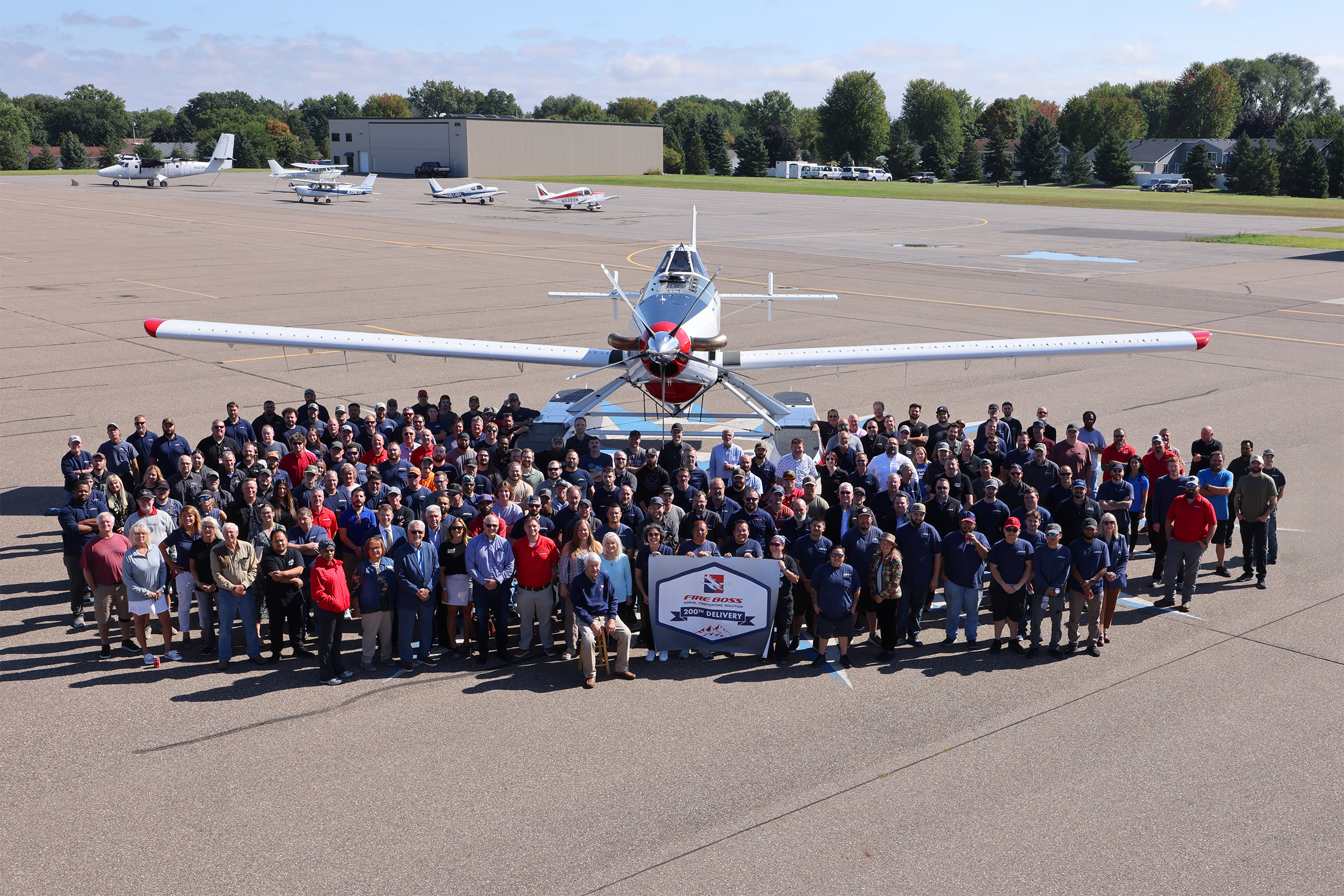 The employees of Wipaire celebrate the delivery of Fire Boss No. 200. [Courtesy: Wipaire]