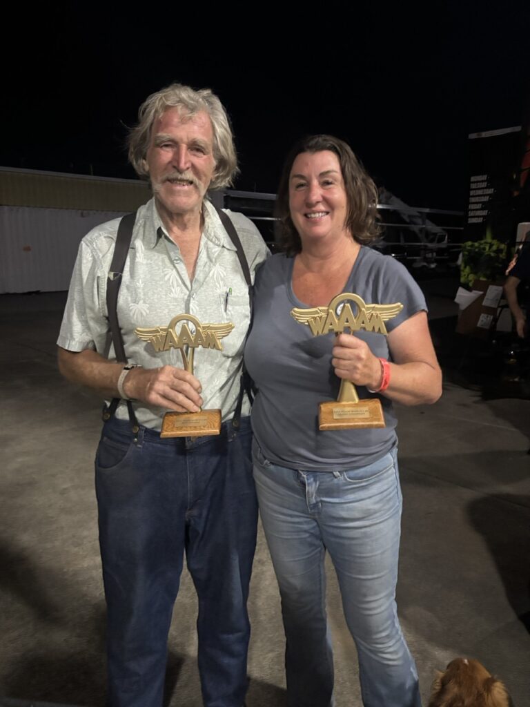Showing off their WAAAM awards, Summer Martell (left) poses with Bean Thun at the annual Hood River Fly-in. [Courtesy: Summer Martell]