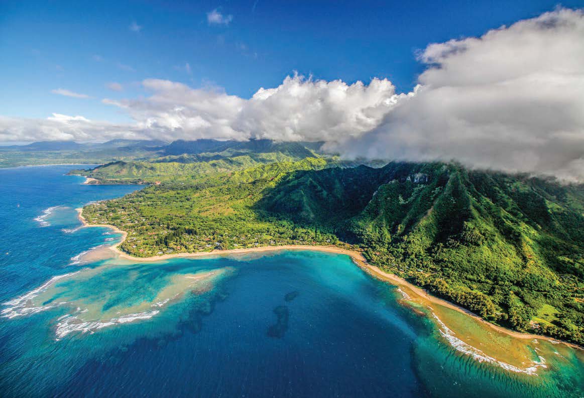 Tour helicopters are common along the scenic but inaccessible Na Pali Coast in Hawaii. [Adobe Stock]
