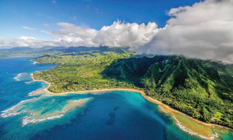 Tour helicopters are common along the scenic but inaccessible Na Pali Coast in Hawaii. [Adobe Stock]