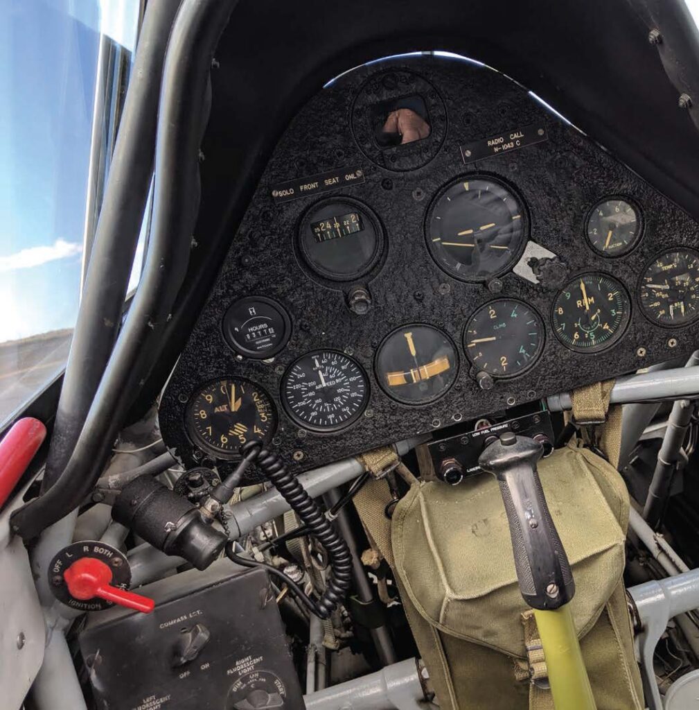 The rear cockpit instrumentation of the SNJ-5 (right). Although it was an instrument trainer, it still retained the ability to swivel the rear seat 180 degrees. [Credit: Alex Munro]