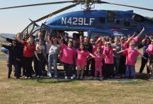 Participants in the 11th annual Girls in Aviation Day at Harvey Field Airport (S43) in Snohomish, Washington, pose with a LifeFlight helicopter. [Courtesy: Cailee Landis]