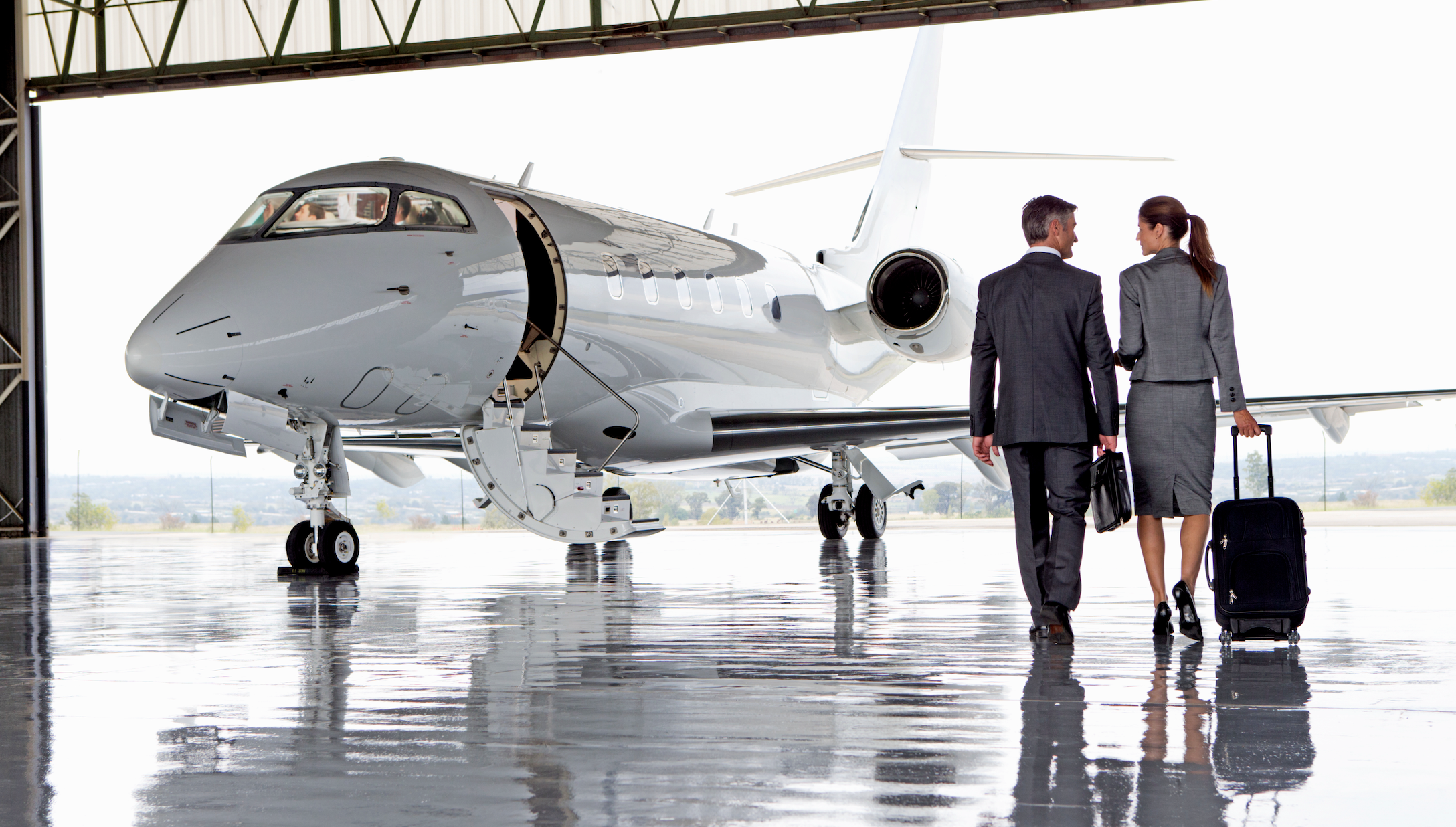 Executives board jet [Shutterstock]