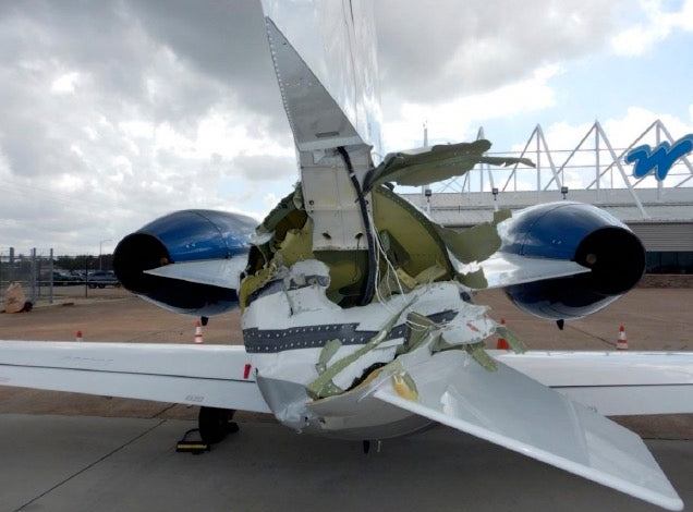 Aft view of the Citation damage to its empennage. [Credit: NTSB]