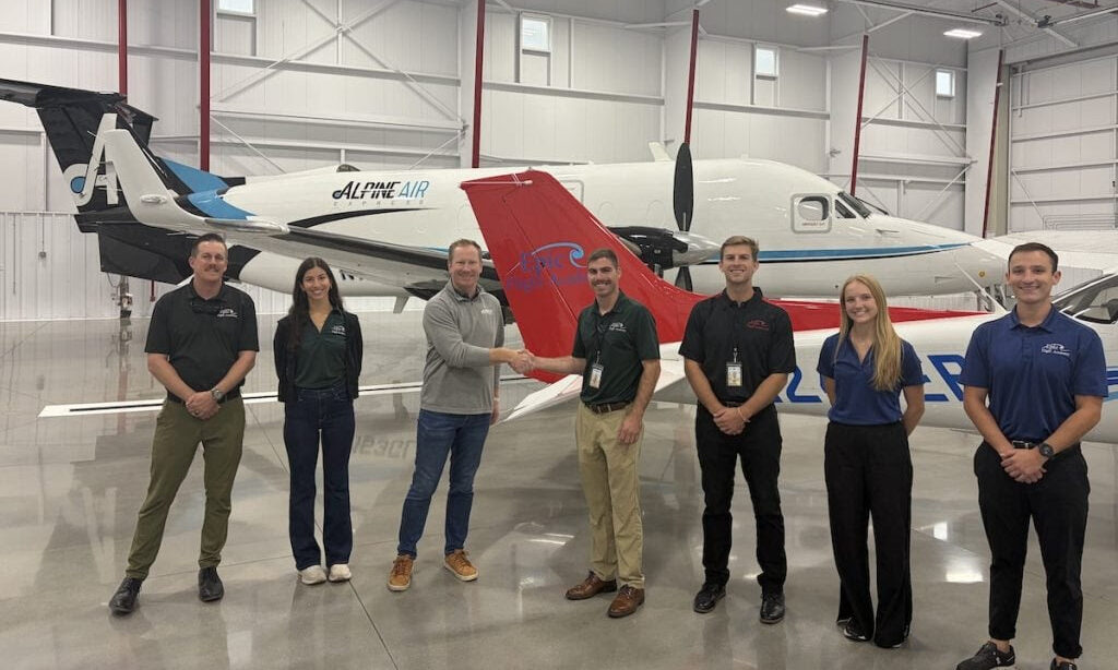 Ray Altmann (from left), Lexi Forester, Matt Klies, Brock Rees, Duke Shepherd, Ashlyn MacVeigh, and Tomas Ruales pose at Epic Flight Academy’s new Provo, Utah, facility.) [Courtesy: Epic Flight Academy]